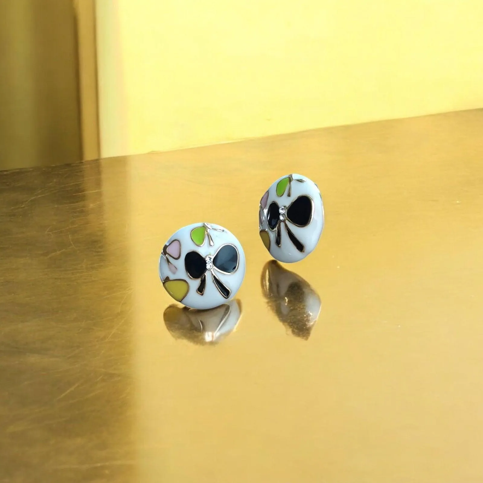Floral White Stud Earrings with Black Butterfly Motifs